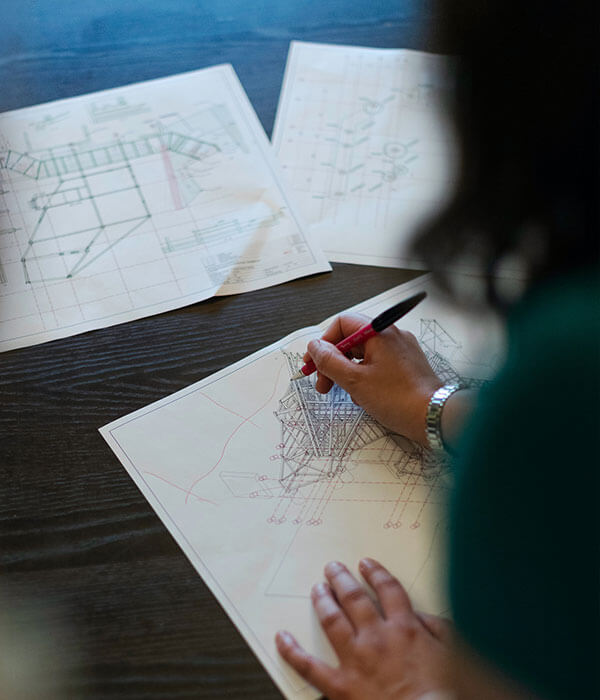 Female architect going through building plans